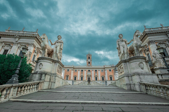 Cordonata capitolina, a stone walkway to the capitol hill in Rome, access to the Senatorial palace on the top. Cloudy day with dramatic skies.