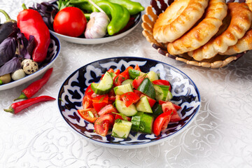 Salad of tomatoes and cucumbers. Eastern cuisine. Uzbek cuisine.