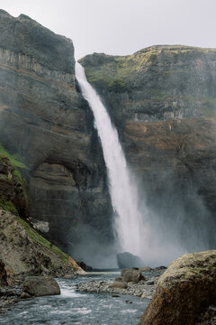 Full view of Iceland Granni waterfall descending into coursing river
