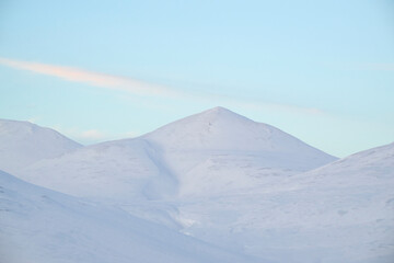 Fototapeta na wymiar Cold mountain slope covered in winter