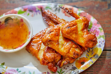 Grilled chicken meat with sauce served on plate