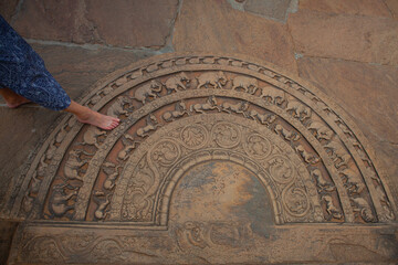 Stone threshold with ornaments before the entrance to the The te