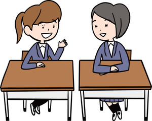 教室の机を並べた隣同士の女子学生