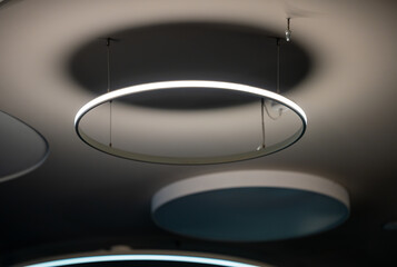Circular pendant lights hanging from the ceiling