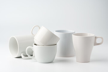 Blank white mugs mock up on white background