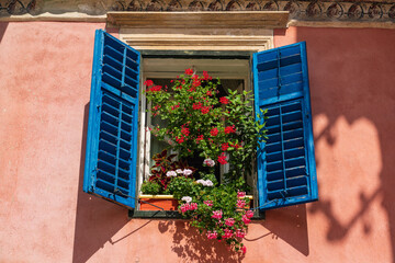 Fototapeta na wymiar Window with flowers in Sibiu, Transylvania, Romania