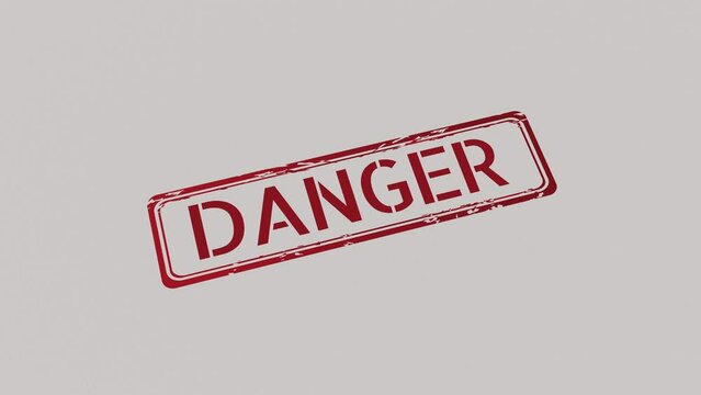 DANGER Stamp pressing on a paper