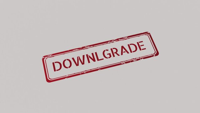 DOWNGRADE Stamp pressing on a paper