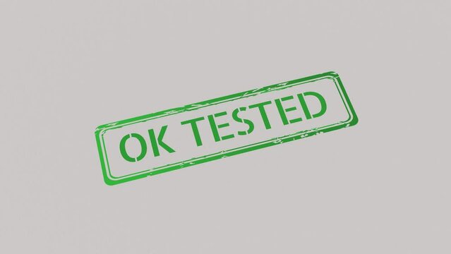 OK TESTED Stamp pressing on a paper