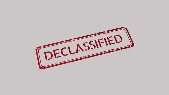 DECLASSIFIED Stamp pressing on a paper