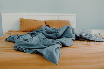 Close up image of bed with bed clothes and pillows. Housekeeping concept