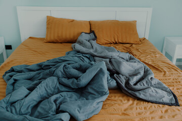 Close up image of bed with bed clothes and pillows. Housekeeping concept