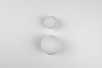 Top view of 3D white balls on white background. Two balls flat lay. Copy space.