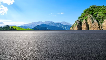 Tuinposter Asphalt road and mountain natural landscape under the blue sky © ABCDstock