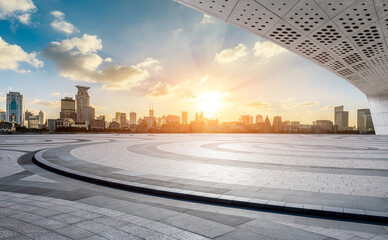 Empty square floor and city skyline with modern buildings scenery at sunset in Shanghai. Famous Bund landmark in Shanghai.