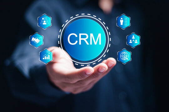 CRM Customer Relationship Management concept. businessman hold virtual customer network management and development of customer information exchange, social media, digital online.