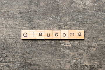 GLAUCOMA word written on wood block. GLAUCOMA text on cement table for your desing, concept