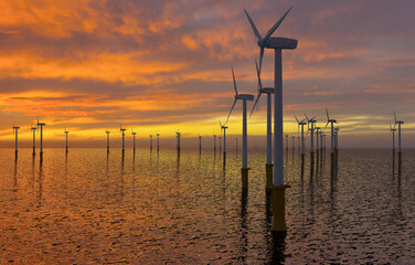 Offshore wind farm at sunset.3D illustration.