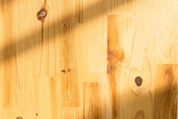 abstract gray shadow background on wooden floor texture, shade with sunlight.