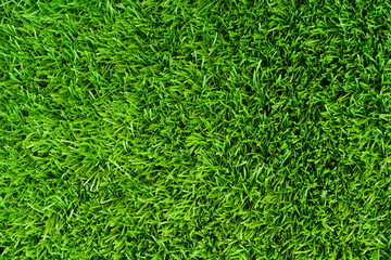 Top of view Close up of vibrant green artificial grass turf in residential. - obrazy, fototapety, plakaty