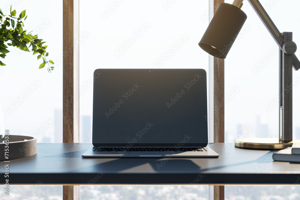 Poster Contemporary designer desktop with mock up laptop computer, various objects and window with city view in the background. 3D Rendering.