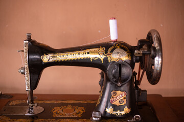 Close up Old sewing machine with white thread
