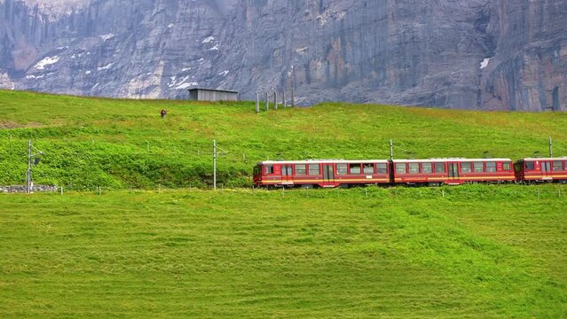 Train from Kleine Scheidegg to Jungfraujoch. Tourist destination to near Lauterbrunnen, Interlaken. Swiss Alps in summer.