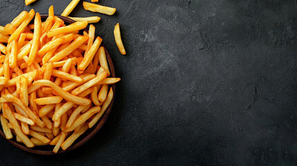 French fries on a gray concrete surface - obrazy, fototapety, plakaty