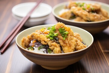 eggplant tempura halves by a bowl of teriyaki