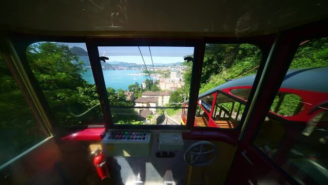 Funicular railcar train to Monte Bre mountain, Cassarate railway. Panoramic view of Lake Lugano. Ticino Switzerland. Swiss Alps. 4k