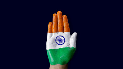 Hands Plam painted with saffron, white and green to represent tricolor Indian national flag. 26 January Republic  day. 15 August Independence day India. celebration of freedom. Copy space for text.