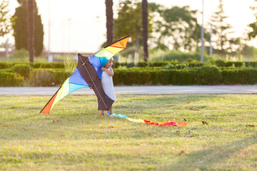 little girl flying a kite