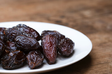 Brown dried Medjool dates are energy-dense fruits rich in many beneficial nutrients.