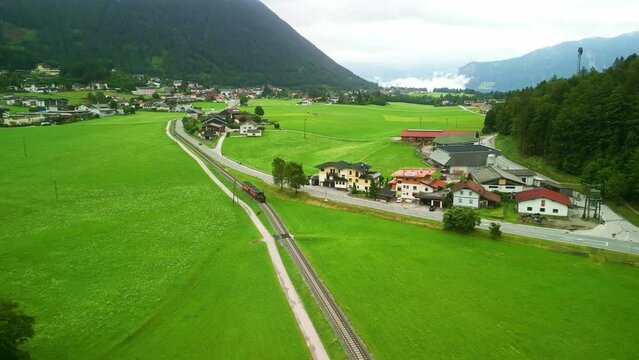 cog railway steam train on Achen Lake Achensee in Austrian Alps. popular tourist sightseeing destination in Tyrol region. Drone aerial view 