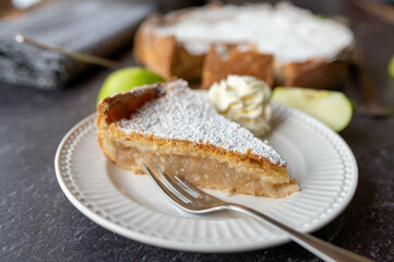 Irish apple pie with whipped cream on a plate