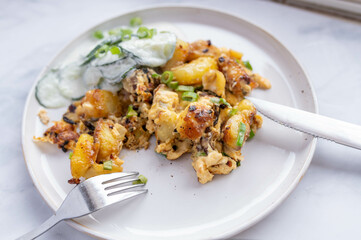 Fried potatoes with eggs on a plate