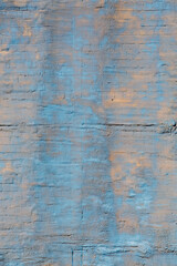 Fototapeta na wymiar Grunge wall, stucco rough surface. Cyan and beige, vertical. Background or texture for design