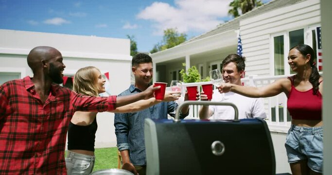 Friends, drinks and toast, celebration and barbecue with party and American flag outdoor. People, holiday and meal together with diversity, social and alcohol for cheers for fourth of July in USA