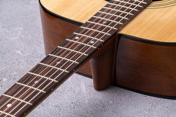 Classical guitar close up. Acoustic guitar on wood background.Music instrument concept