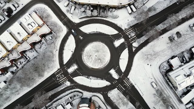 Traffic circle road, sunny winter, aerial drone rotation stock video