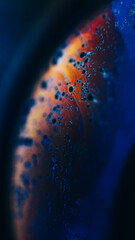 Bubble fluid. Oil liquid texture. Paint water. Defocused blue red color glowing ink wave motion sphere surface abstract art background.