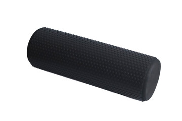 A black foam massage roller isolated on a white background. Foam rolling is a self myofascial release technique. Gym fitness equipment.