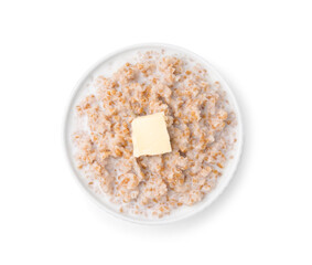 Tasty wheat porridge with milk and butter in bowl isolated on white, top view