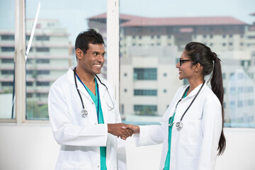 Two Indian doctors shaking hands