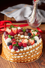 Fruit and Cream Layered Cake on Festive Table - 715414373