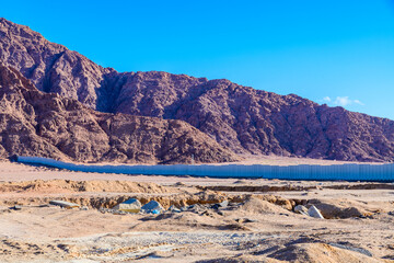 View of the mountains at Sinai peninsula in Egypt. Protective wall around of city Sharm el Sheikh