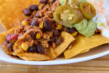 Mexican chili con carne with nachos and guacamole