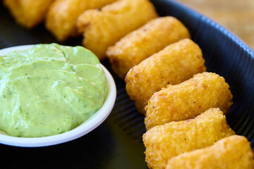 Croquettes with guacamole and mayonnaise