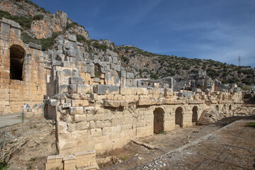 Fototapeta na wymiar Ruins of the ancient city of Myra in Demre, Turkey. Ancient tombs and amphitheater.