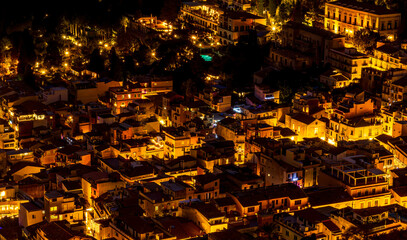 Beautiful view of night town of Italy with colorful golden lights, night landscape on city of Europe